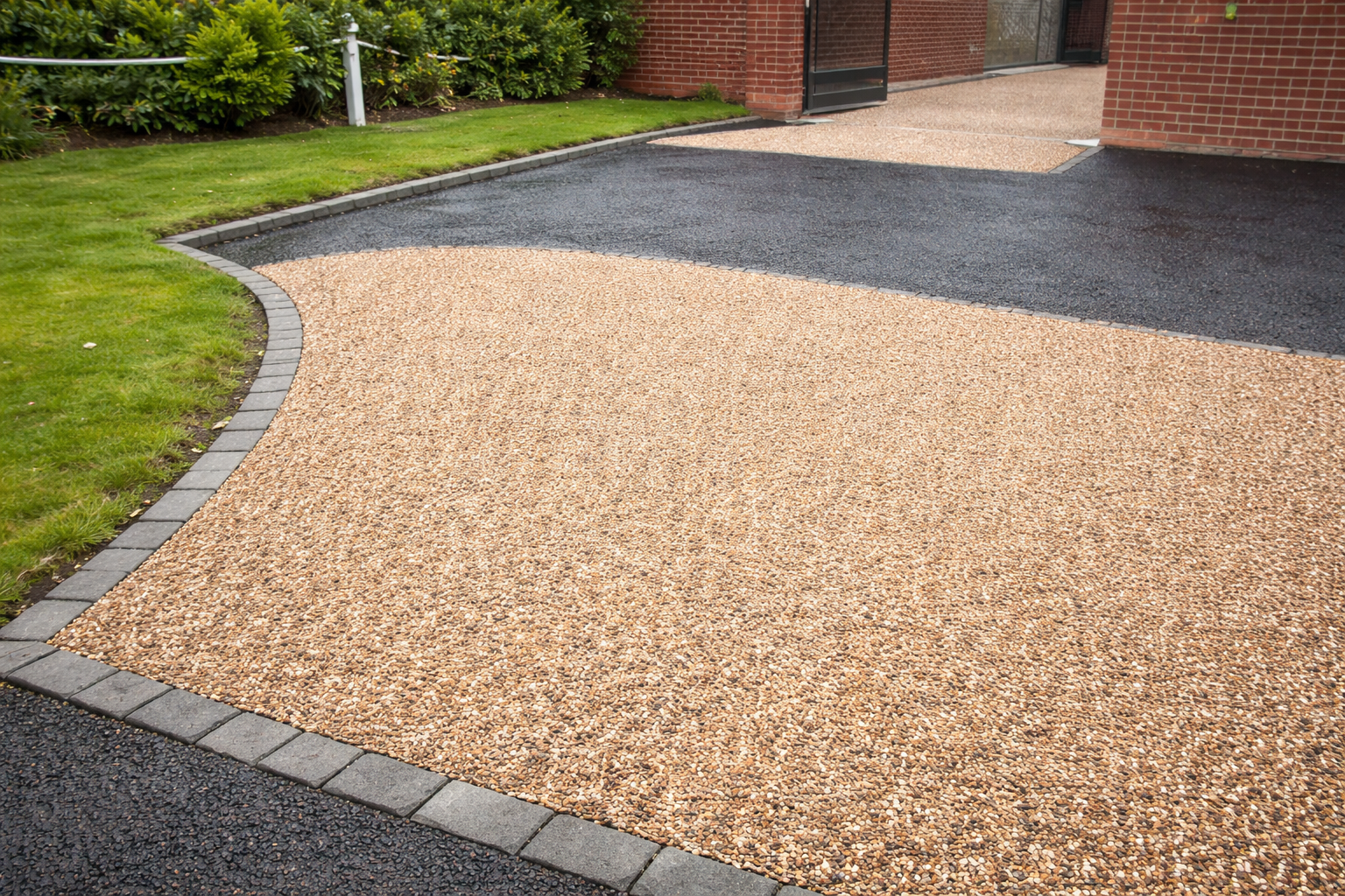 Tar and chip driveway with natural stone finish on a UK residential property